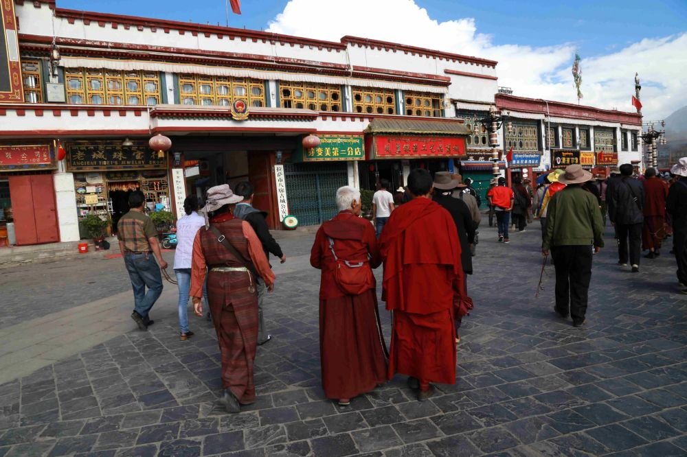 Tibetans walking on the Bakhor Street in Lhasa
