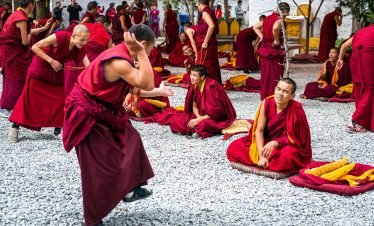 Monks debating at Sera Monastery courtyard