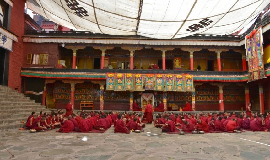 Monks in courtyard at Tashi Lhunpo Monastery