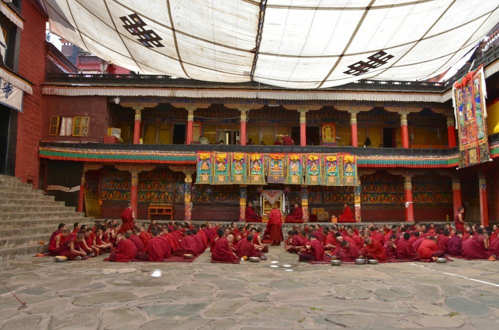 Monks in courtyard at Tashi Lhunpo Monastery