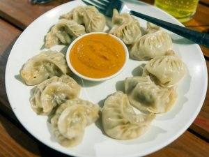 Deliciously steamed Tibetan Momo being enjoyed by a group